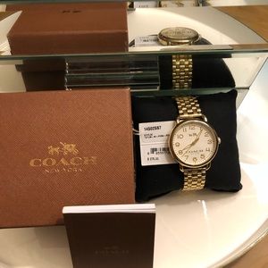 Women’s Gold tone Coach watch
